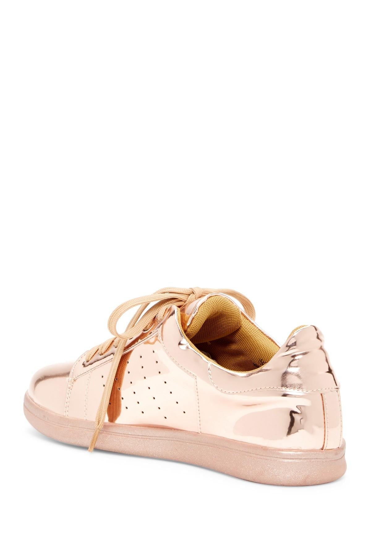 DC-N.Y.L.A. Shoes in rose gold with a sleek design and stylish detailing, perfect for casual wear.