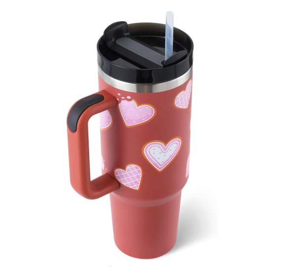 DC-N.Y.L.A. insulated stainless steel tumbler with handle and straw, ideal for coffee on the go.