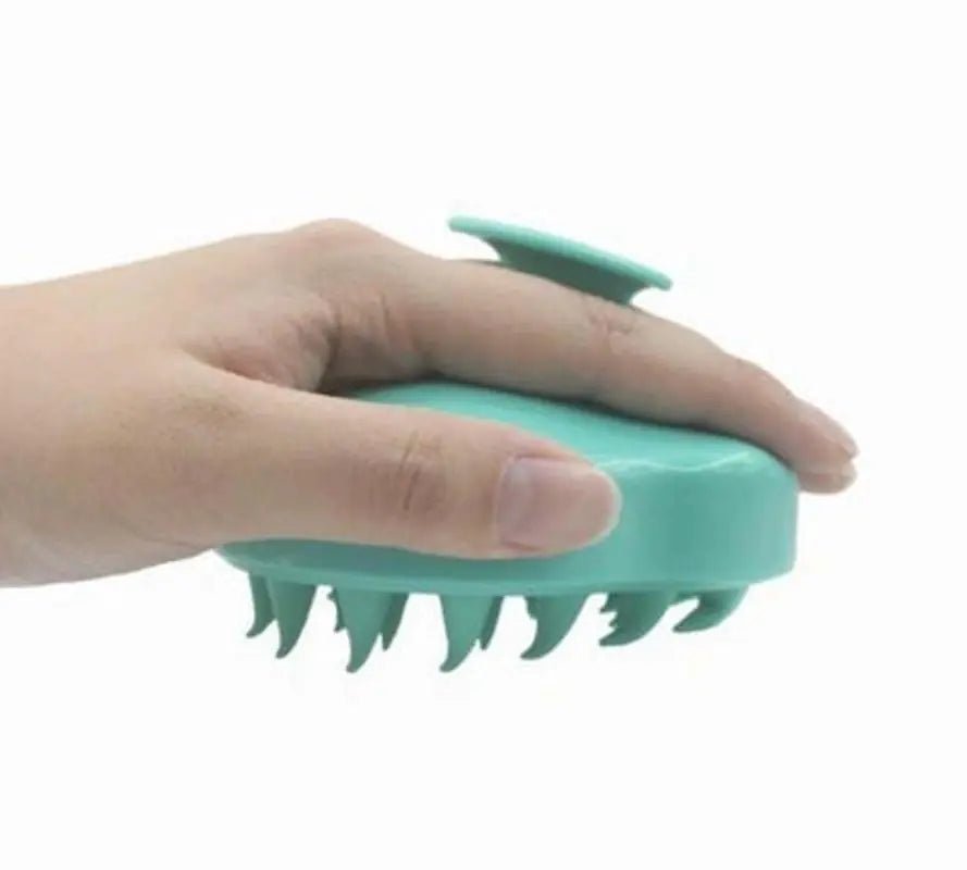 APEX hair scalp massager with soft silicone bristles for soothing and stimulating the scalp during washing.